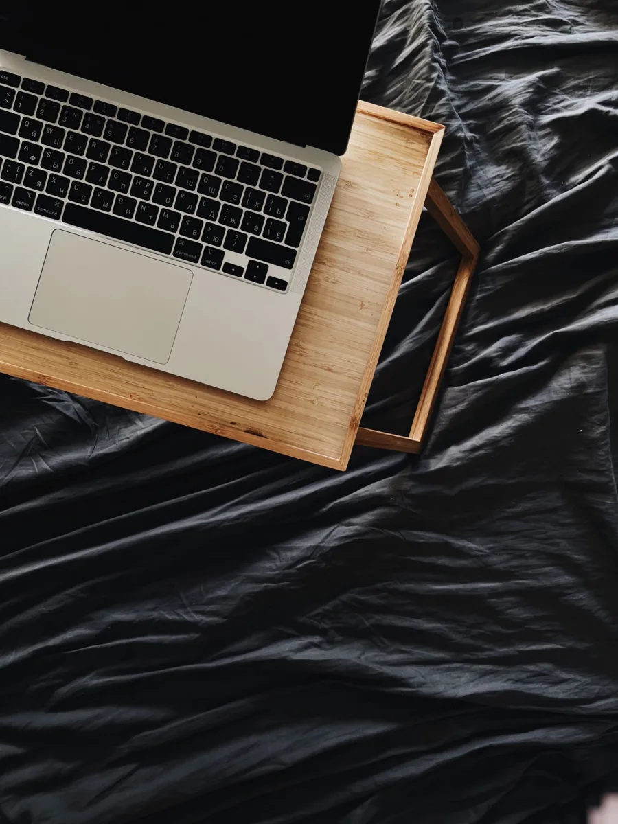 Laptop on a wooden lap desk