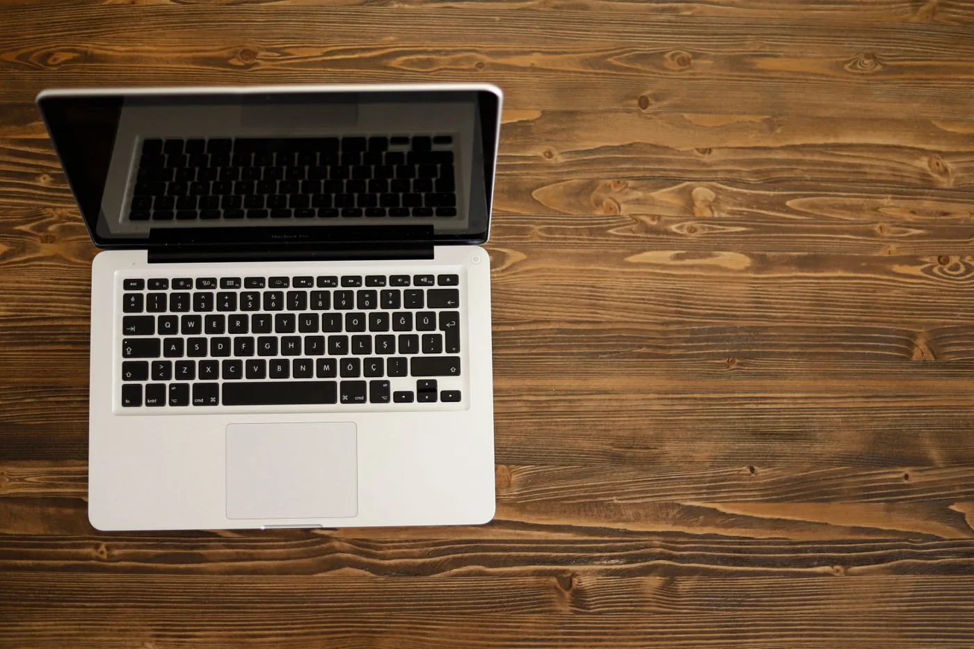 Laptop photographed from above on a wooden table