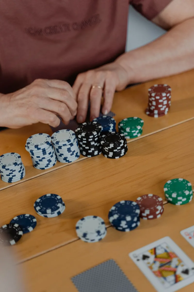 Stacks of poker chips arranged by colour