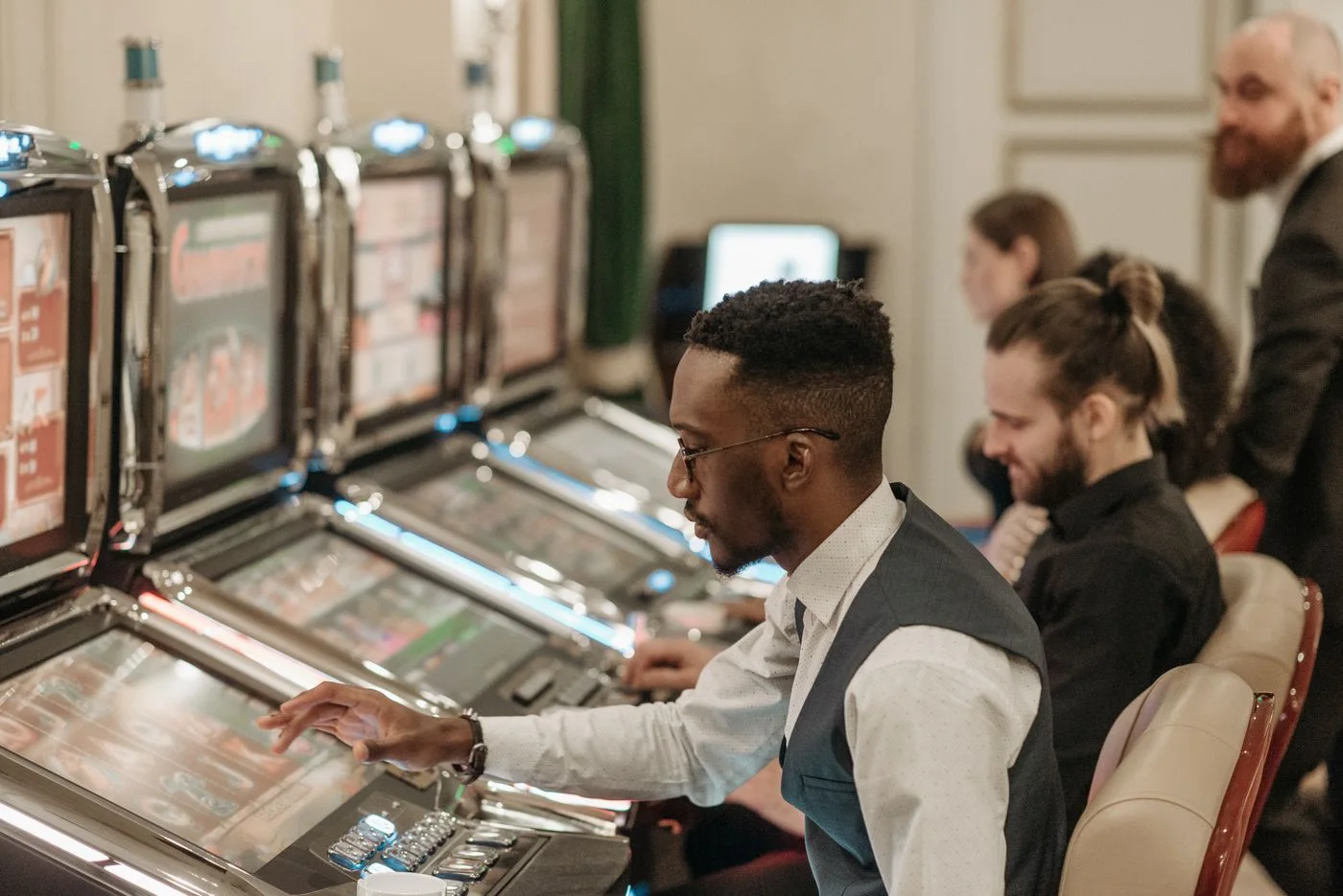 Casino guests seated at gaming machines
