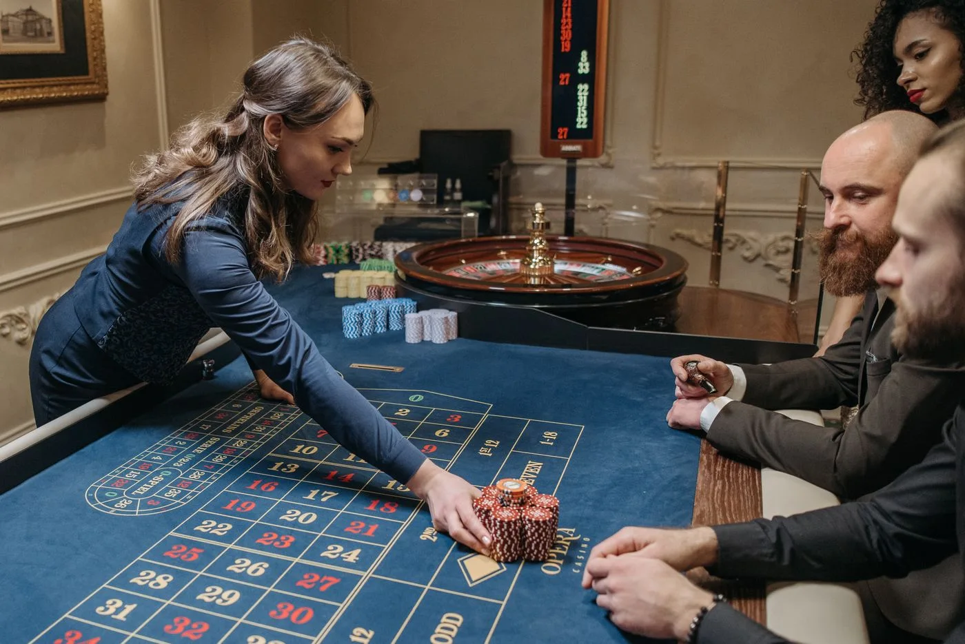 A dealer overseeing a casino table