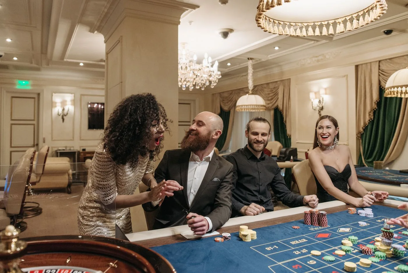 Guests seated around a casino gaming table