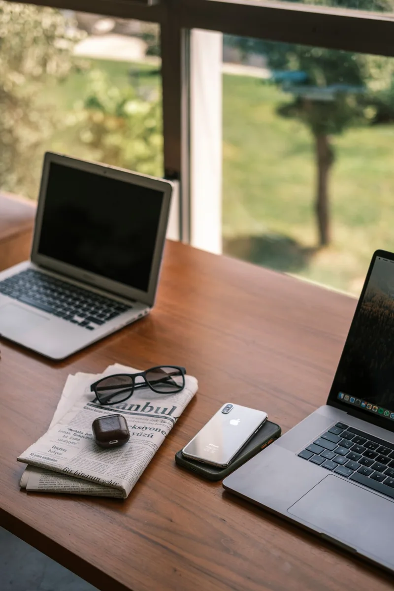 Laptop and accessories on a wooden desk